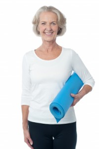 Seniors and Exercise: Senior Woman with Yoga Mat